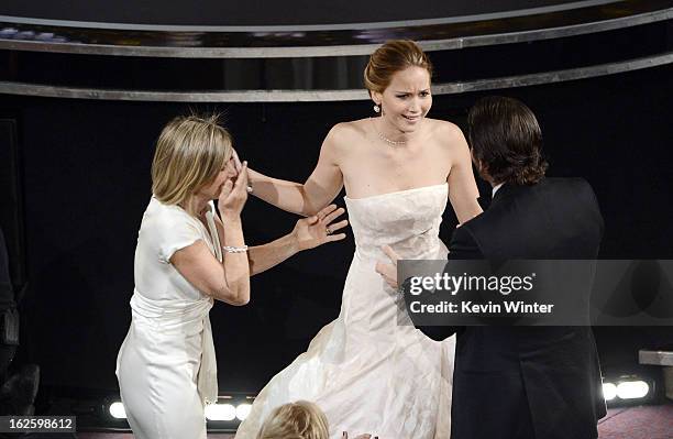 Actress Jennifer Lawrence , mother Karen Lawrence and actor Bradley Cooper celebrate after Lawrence wins the Best Actress award for "Silver Linings...