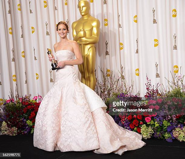Actress Jennifer Lawrence, winner of the Best Actress award for "Silver Linings Playbook," poses in the press room during the Oscars held at Loews...