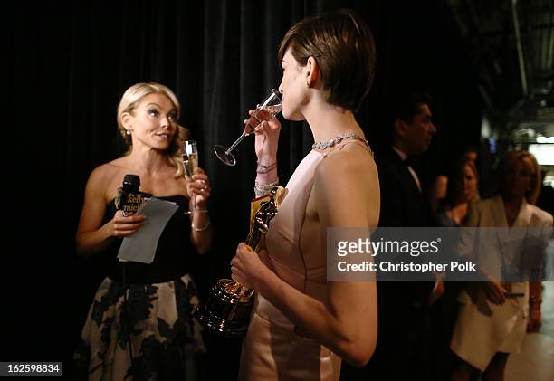 Actress Anne Hathaway , winner of the Best Supporting Actress award for "Les Miserables," and TV personality Kelly Ripa backstage during the Oscars...