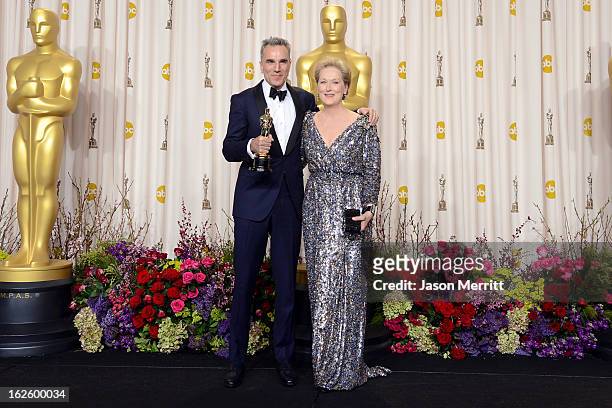 Actor Daniel Day-Lewis, winner of the Best Actor award for "Lincoln," and presenter Meryl Streep pose in the press room during the Oscars held at...
