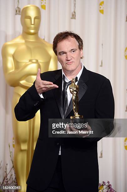 Writer-director Quentin Tarantino, winner of the Best Original Screenplay award for "Django Unchained," poses in the press room during the Oscars...