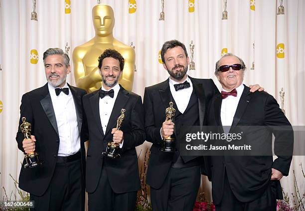 Producers George Clooney and Grant Heslov and actor-producer-director Ben Affleck, winners of the Best Picture award for "Argo," with presenter Jack...