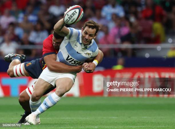 Spain's Facundo Dominguez tackles Argentina's fly-half Nicolas Sanchez during the pre-World Cup international friendly rugby union match between...