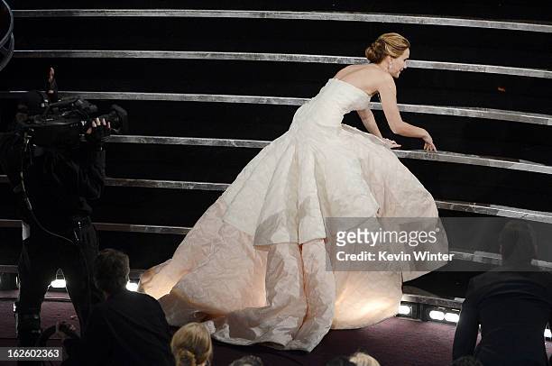 Actress Jennifer Lawrence reacts after winning the Best Actress award for "Silver Linings Playbook" during the Oscars held at the Dolby Theatre on...