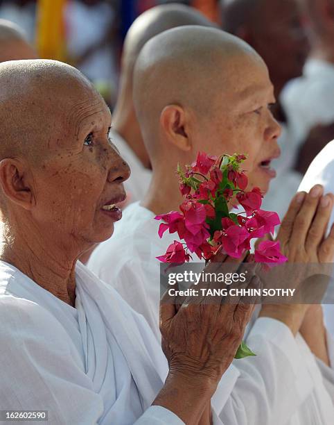 Cambodian nuns pray during the Meak Bochea Buddhist celebration at the Oddong mountain in Kandal province, some 40 kilometers north of Phnom Penh on...