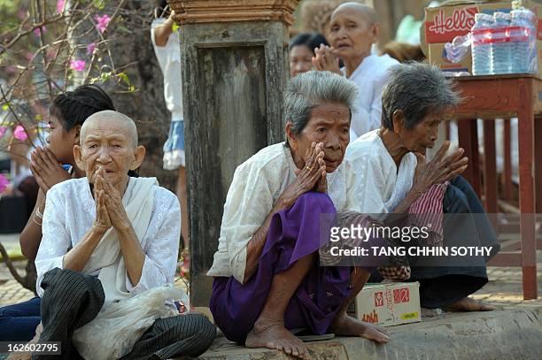 Cambodian people pray during the Meak Bochea Buddhist celebration at the Oddong mountain in Kandal province, some 40 kilometers north of Phnom Penh...