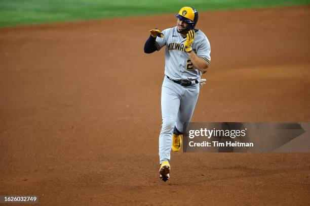 Willy Adames of the Milwaukee Brewers reacts after hitting a solo home run in the sixth inning against the Texas Rangers at Globe Life Field on...