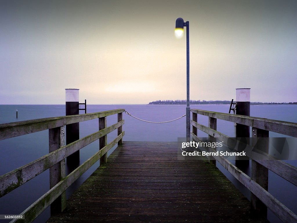 Small Jetty In Cold Evening Light