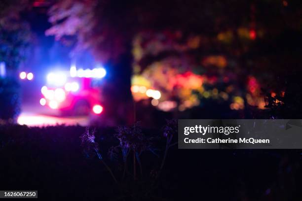 emergency vehicles attend to emergency in residential neighborhood - cena do crime imagens e fotografias de stock