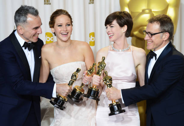 Actors Daniel Day-Lews, Jennifer Lawrence, Anne Hathaway, and Christoph Waltz pose in the press room during the Oscars at Loews Hollywood Hotel on...