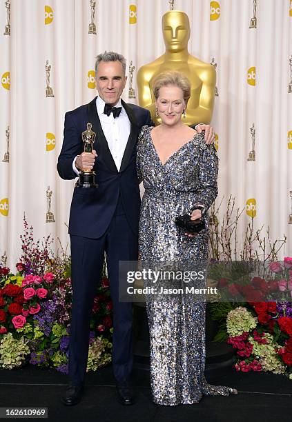 Actor Daniel Day-Lewis, winner of the Best Actor award for 'Lincoln,' and presenter Meryl Streep pose in the press room during the Oscars held at...