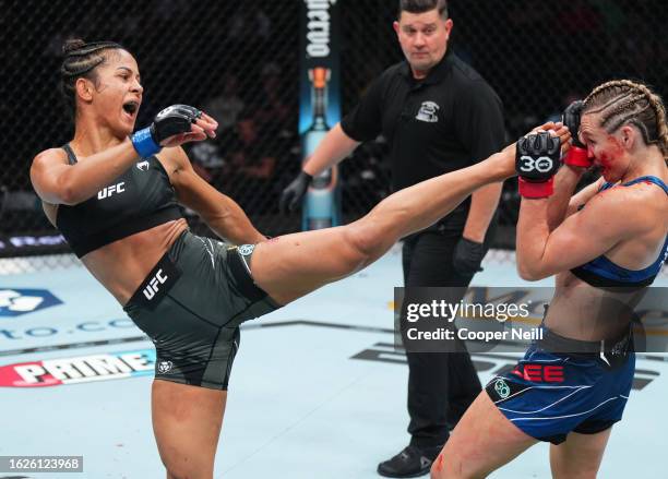 Natalia Silva of Brazil kicks Andrea Lee in a flyweight fight during the UFC 292 event at TD Garden on August 19, 2023 in Boston, Massachusetts.