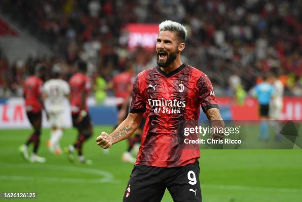 Olivier Giroud of AC Milan celebrates after scoring the team's second goal via penalty during the Serie A TIM match between AC Milan and Torino FC at...
