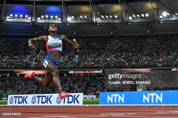 S Sha'Carri Richardson celebrates as she crosses the finish line to win the women's 4x100m relay final during the World Athletics Championships at...