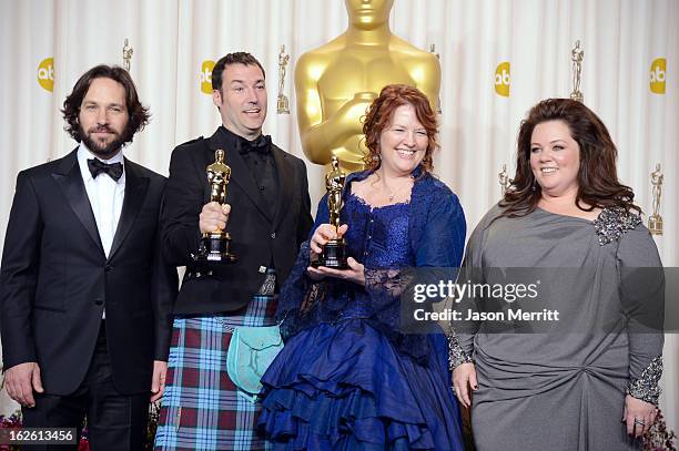Directors Mark Andrews and Brenda Chapman , winners of the Best Animated Feature award for "Brave," with presenters Paul Rudd and Melissa McCarthy ,...