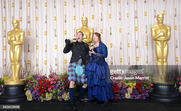 Directors Mark Andrews and Brenda Chapman, winners of the Best Animated Feature award for 'Brave,' pose in the press room during the Oscars held at...