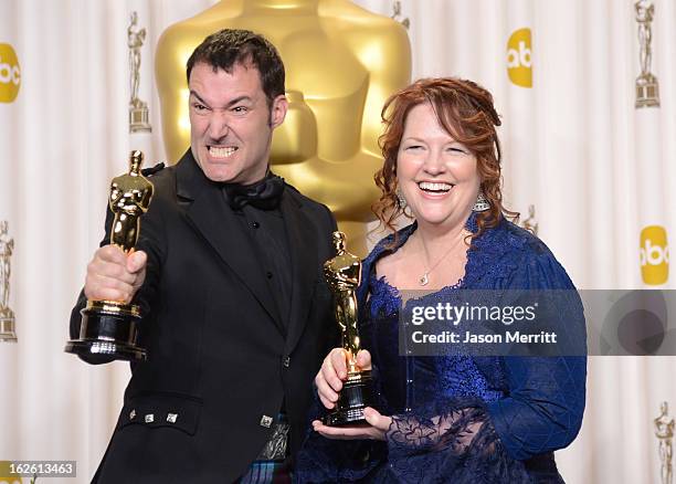 Directors Mark Andrews and Brenda Chapman, winners of the Best Animated Feature award for 'Brave,' pose in the press room during the Oscars held at...