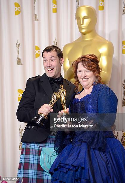 Directors Mark Andrews and Brenda Chapman, winners of the Best Animated Feature award for 'Brave,' pose in the press room during the Oscars held at...