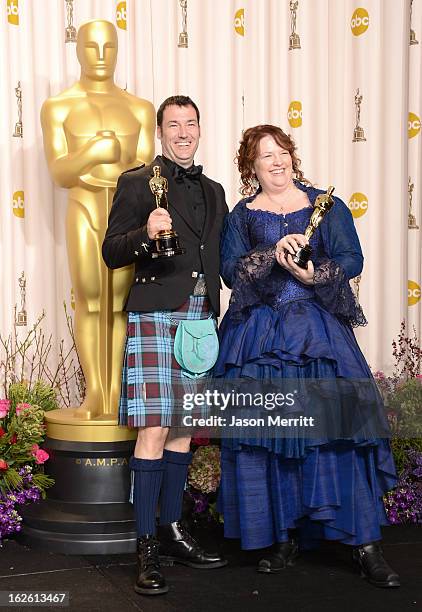 Directors Mark Andrews and Brenda Chapman, winners of the Best Animated Feature award for 'Brave,' pose in the press room during the Oscars held at...