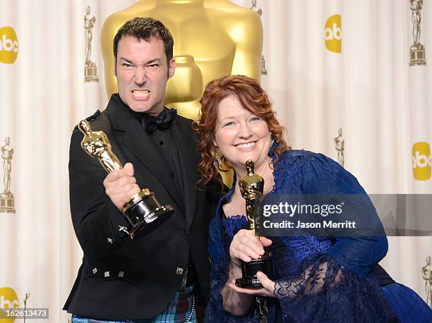 Directors Mark Andrews and Brenda Chapman, winners of the Best Animated Feature award for 'Brave,' pose in the press room during the Oscars held at...