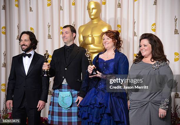 Directors Mark Andrews and Brenda Chapman , winners of the Best Animated Feature award for "Brave," with presenters Paul Rudd and Melissa McCarthy ,...