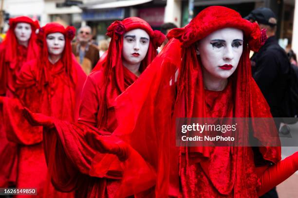 Dozen climate activists from extinction rebellion bonn gather at old town Hall in Bonn on August 26, 2023 and protest against Ecocide as World...