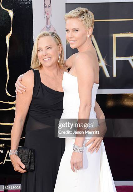 Charlize Theron and Gerda Jacoba Aletta Maritz arrive at the Oscars at Hollywood & Highland Center on February 24, 2013 in Hollywood, California.