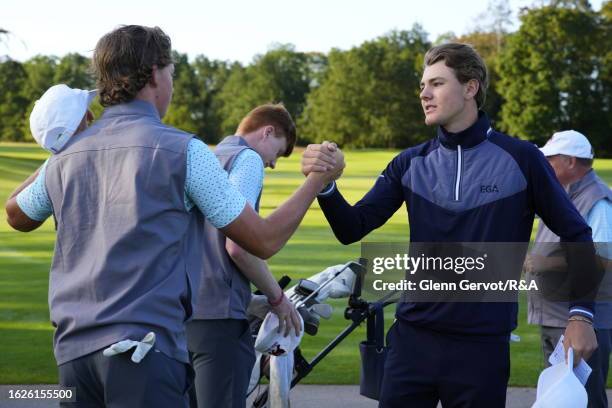 Continent of Europe player Peer Wernicke checks Team Great Britain and Ireland player Niall Sheils Donegan on the 1st hole on Day Two of the The...