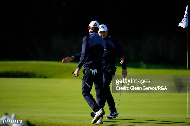 Team Great Britain and Ireland players Tim Wiedemeyer checks Peer Wernicke on Day Two of the The Jacques Leglise Trophy at Golf de Chantilly on...