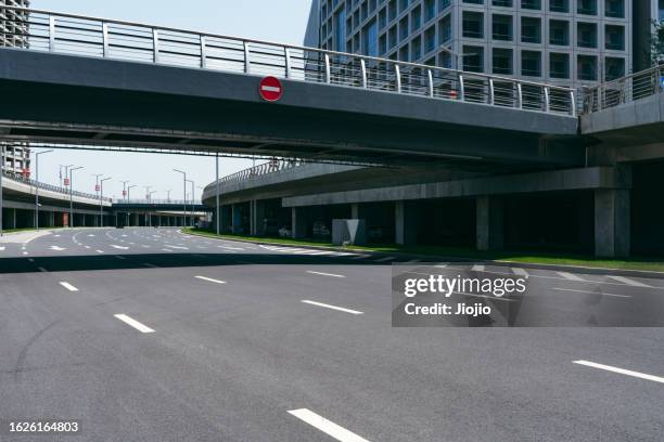 city street below the elevated road - pedestrian bridge stock pictures, royalty-free photos & images