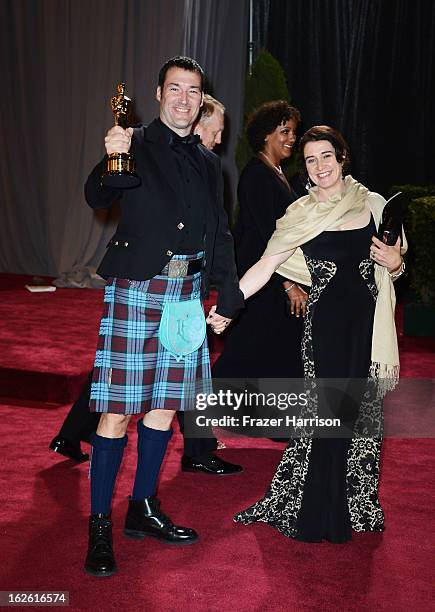 Director Mark Andrews , winner of the Best Animated Feature award for 'Brave,' and guest depart the Oscars at Hollywood & Highland Center on February...