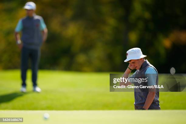 Team Great Britain and Ireland player Jack Murphy reacts after missing his shot out of the bunker on the 15th hole on Day Two of the The Jacques...