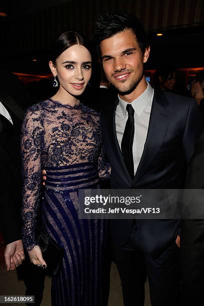 Actors Lily Collins and Taylor Lautner attend the 2013 Vanity Fair Oscar Party hosted by Graydon Carter at Sunset Tower on February 24, 2013 in West...