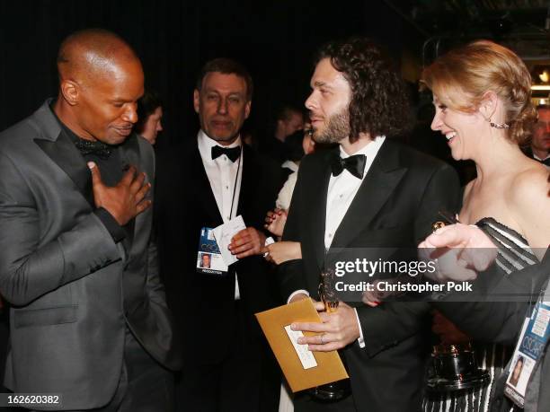 Jamie Foxx, and filmmakers Sean Fine and Andrea Nix Fine, winners of the Best Documentary Short Subject award for 'Inocente,' backstage during the...