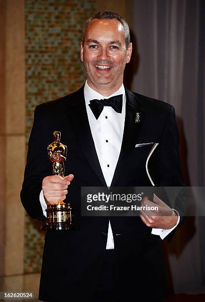 Visual effects artist Erik-Jan de Boer, winner of the Best Visual Effects award for 'Life of Pi' departs the Oscars at Hollywood & Highland Center on...