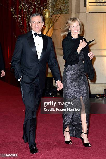 Walt Disney Company Chairman and CEO Robert Iger and wife, Willow Bay, depart the Oscars at Hollywood & Highland Center on February 24, 2013 in...