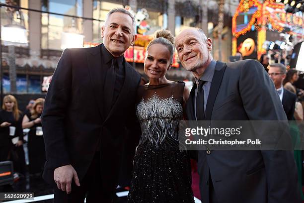 Oscars Telecast Executive Producer Craig Zadan, actress Kristin Chenoweth and Oscars Telecast Executive Producer Neil Meron arrive at the Oscars held...