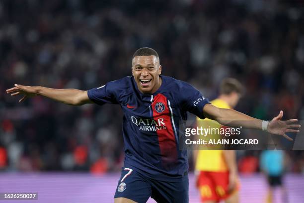 Paris Saint-Germain's French forward Kylian Mbappe celebrates scoring Paris Saint-Germain's third goal during the French L1 football match between...