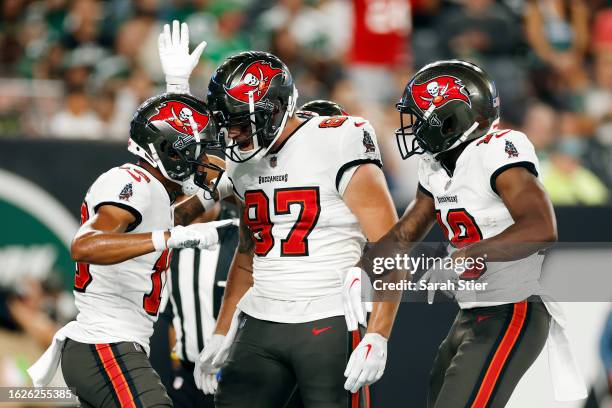 Payne Durham celebrates with Trey Palmer of the Tampa Bay Buccaneers after Palmer's touchdown catch during the first half of a preseason game against...