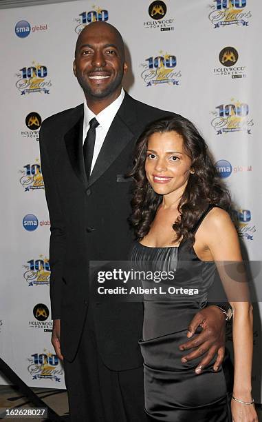 Athlete John Salley and wife arrive for the 23rd Annual Night Of 100 Stars Black Tie Dinner Viewing Gala held at Beverly Hills Hotel on February 24,...