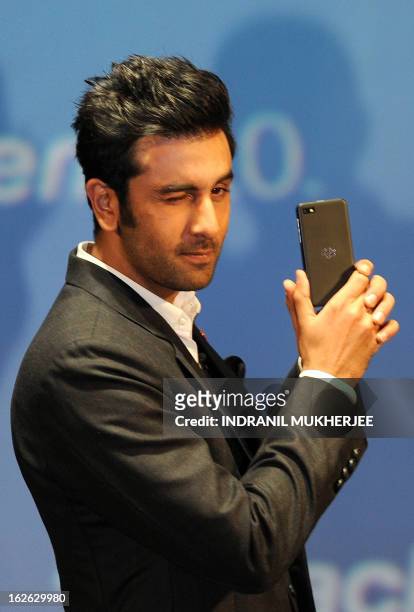 Bollywood film actor and BlackBerry brand ambassador, Ranbir Kapoor poses with the BlackBerry Z10 at the country launch of the BlackBerry Z10 in...