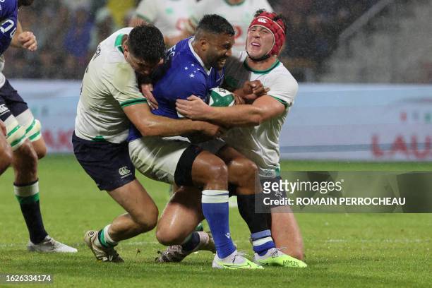 Samoa's fly-half Lima Sopoaga is tackled by Ireland's hooker Tom Stewart during the pre-World Cup rugby union test match between Ireland and Samoa on...