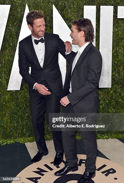 Actors Gerard Butler and Emile Hirsch arrive at the 2013 Vanity Fair Oscar Party hosted by Graydon Carter at Sunset Tower on February 24, 2013 in...