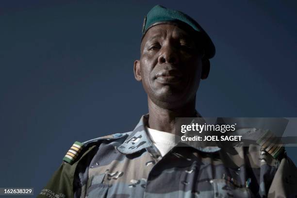 Malian chief of Gao's gendarmerie district, Colonel Salhiou Maiga poses in the office of the Gao's gendarmerie in Gao on February 24, 2013. After...