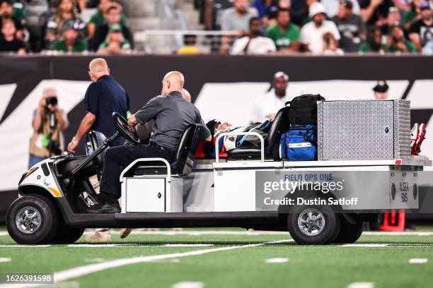 John Wolford of the Tampa Bay Buccaneers is carted off the field during the third quarter of the preseason game against the New York Jets at MetLife...