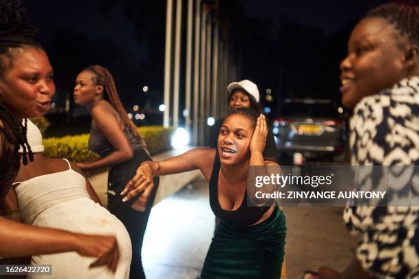 Supporters of Zimbabwe incumbent president Emmerson Mnangagwa celebrate his reelection in Harare on August 26, 2023. Zimbabwe's leading opposition...