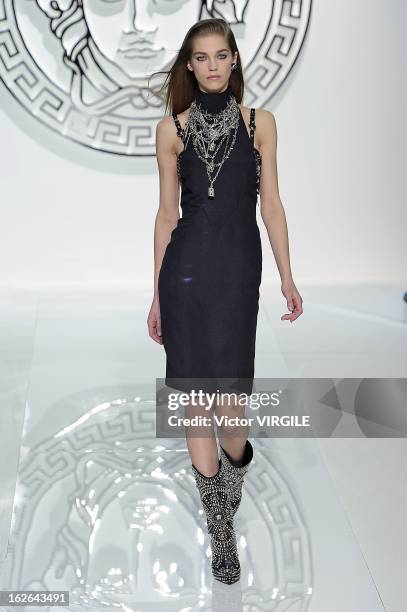 Model walks the runway at the Versace Ready to Wear Fall/Winter 2013-2014 fashion show during Milan Fashion Week Womenswear Fall/Winter 2013/14 on...