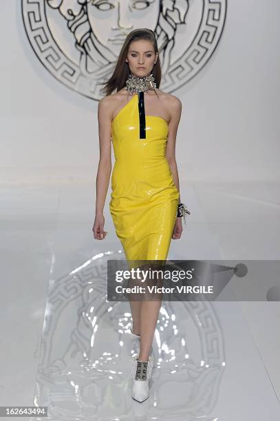 Model walks the runway at the Versace Ready to Wear Fall/Winter 2013-2014 fashion show during Milan Fashion Week Womenswear Fall/Winter 2013/14 on...