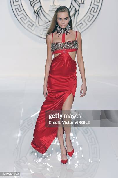 Cara Delevingne walks the runway at the Versace Ready to Wear Fall/Winter 2013-2014 fashion show during Milan Fashion Week Womenswear Fall/Winter...