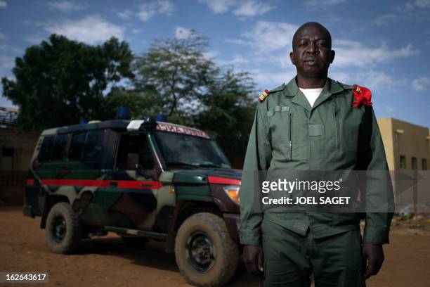 Malian army Colonel, doctor Madani Dembele, aged 48, poses on February 25, 2013 in Gao, some 1,200 kilometres north of Bamako. After recapturing the...
